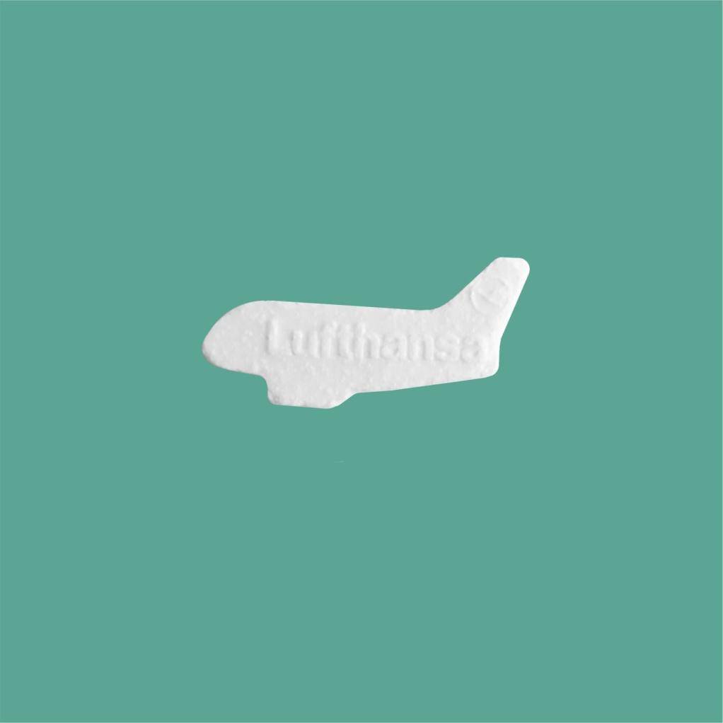 Plane shaped and embossed fresh breah mints with company logo